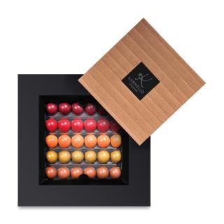 A Set Of Caramel And Fruit Chocolates For Children's Day In A Box With A White Lid And Frame